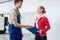 Worker and manager doing handshake on factory floor