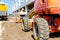 Worker is managing a cherry picker at building site