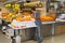 Worker at the market with oranges and fresh fruit juices, a specialty of Valencia, Spain