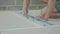Worker marking a drywall sheet for installing it in newly built house.