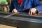 Worker measuring fresh welded steel bar