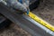 Worker measuring steel