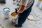 Worker mixing yellow epoxy resin with the mixer