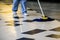 Worker mopping to clean floor