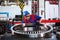 The worker moves a large diameter bearing. Bearing plant. The displacement of the bearings of large diameter. Machines for