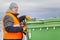 Worker near the garbage containers in winter