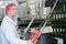 Worker operating controls in wine bottling plant