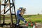 Worker with pipe wrench on pipeline