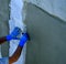 Worker placing mesh sheet plastic