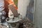 worker plastering cement on wall for building house