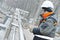 Worker polishing metal fence barrier