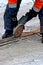 Worker polishing a tram rail