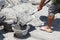 Worker pouring concrete to formwork construction site