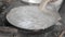 Worker pouring soy milk into the cooking pan