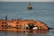 Worker prepare to salvage wrecked ship