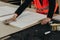 A worker prepares PVC furniture boards for packaging