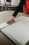 A worker prepares PVC furniture boards for packaging