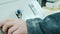 Worker presses the start button on a modern CNC woodworking machine, close-up