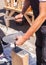 Worker produces roofing slate using a slate hammer.