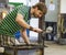 Worker producing a piece of glass