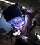 Worker with protective mask welding