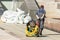 Worker pulls a hose pumping station construction technology