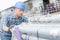 Worker pushing stack scaffold poles