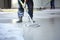 Worker puttying the floor with a spatula in a construction site, Construction worker use screed concrete epoxy for level mixture