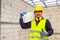 Worker reassure holds autoclaved aerated bricks in construction site, Concept proposes to use autoclaved aerated bricks in