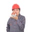 Worker in red hard hat kisses small house model in hand