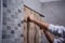 Worker remove demolish old tiles in a bathroom