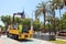 Worker removes portable metal fences from ground into a special cargo transport