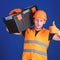 Worker, repairer, repairman, builder on confident face carries toolbox on shoulder. Man in helmet, hard hat holds