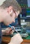 Worker repairing computer equipment