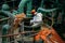 Worker repairs pipe connections of large steel tank