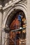 A Worker Restoring a Giant Door