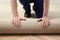 Worker rolling out new carpet flooring indoors, closeup