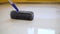 Worker rolls liquid floor. Needle roller for bulk floors. Finishing work - the worker is filling the floor
