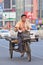 Worker on a rusty three wheeled freight bike, Beijing, China