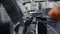Worker\'s Hand In Glove Operate And Set Up The Canning Machine At Beer Factory. - close up