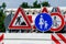 A worker`s truck with roadsigns at a road construction site