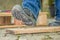 A worker with safety boots steps on a rusty nail