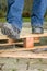 Worker with safety shoes steps on a rusty nail