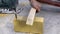 Worker sawing a wooden block jigsaw