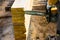 A worker saws off a chainsaw wood Board. House construction