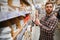 Worker selects an electrical cable at a hardware store