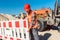 Worker setting up earthworks construction site