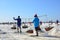 Worker shoveling salt at salt pan at Thailand