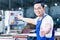 Worker showing thumbs up in Asian production plant