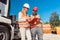 Worker signing papers to have delivered demolition rubble container